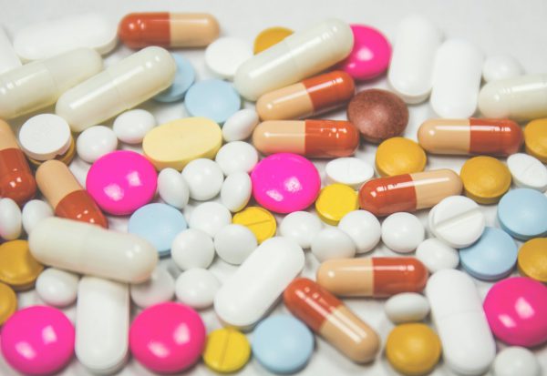 Measured capsules on a spoon